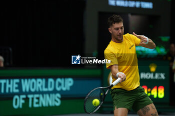 2024-09-10 - Thanasi Kokkinakis of Australia in action against Arthur Fils of France during the Davis Cup 2024, Group B, tennis match played between France and Australia at Fuente de San Luis on September 10, 2024, in Valencia, Spain. Photo Alvaro Diaz / SpainDPPI / DPPI - TENNIS - DAVIS CUP - FRANCE V AUSTRALIA - INTERNATIONALS - TENNIS