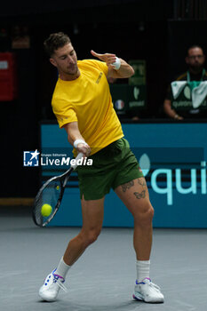 2024-09-10 - Thanasi Kokkinakis of Australia in action against Arthur Fils of France during the Davis Cup 2024, Group B, tennis match played between France and Australia at Fuente de San Luis on September 10, 2024, in Valencia, Spain. Photo Alvaro Diaz / SpainDPPI / DPPI - TENNIS - DAVIS CUP - FRANCE V AUSTRALIA - INTERNATIONALS - TENNIS