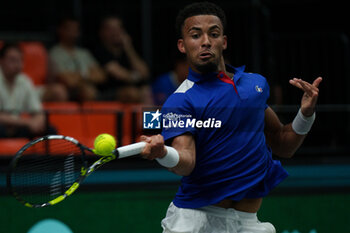 2024-09-10 - Arthur Fils of France in action against Thanasi Kokkinakis of Australia during the Davis Cup 2024, Group B, tennis match played between France and Australia at Fuente de San Luis on September 10, 2024, in Valencia, Spain. Photo Alvaro Diaz / SpainDPPI / DPPI - TENNIS - DAVIS CUP - FRANCE V AUSTRALIA - INTERNATIONALS - TENNIS