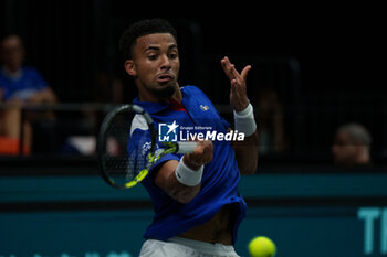 2024-09-10 - Arthur Fils of France in action against Thanasi Kokkinakis of Australia during the Davis Cup 2024, Group B, tennis match played between France and Australia at Fuente de San Luis on September 10, 2024, in Valencia, Spain. Photo Alvaro Diaz / SpainDPPI / DPPI - TENNIS - DAVIS CUP - FRANCE V AUSTRALIA - INTERNATIONALS - TENNIS