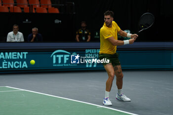 2024-09-10 - Thanasi Kokkinakis of Australia in action against Arthur Fils of France during the Davis Cup 2024, Group B, tennis match played between France and Australia at Fuente de San Luis on September 10, 2024, in Valencia, Spain. Photo Alvaro Diaz / SpainDPPI / DPPI - TENNIS - DAVIS CUP - FRANCE V AUSTRALIA - INTERNATIONALS - TENNIS