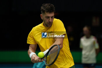 2024-09-10 - Thanasi Kokkinakis of Australia in action against Arthur Fils of France during the Davis Cup 2024, Group B, tennis match played between France and Australia at Fuente de San Luis on September 10, 2024, in Valencia, Spain. Photo Alvaro Diaz / SpainDPPI / DPPI - TENNIS - DAVIS CUP - FRANCE V AUSTRALIA - INTERNATIONALS - TENNIS