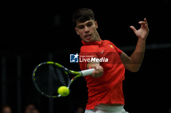 2024-09-11 - Carlos Alcaraz of Spain in action against Tomas Machac of Czech Republic during the Davis Cup 2024, Group B, tennis match played between Czech Republic and Spain at Fuente de San Luis on September 11, 2024, in Valencia, Spain. - CZECH REPUBLIC V SPAIN - DAVIS CUP 2024 GROUP B - INTERNATIONALS - TENNIS