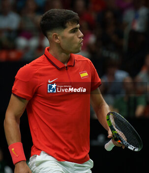 2024-09-11 - Carlos Alcaraz of Spain in action against Tomas Machac of Czech Republic during the Davis Cup 2024, Group B, tennis match played between Czech Republic and Spain at Fuente de San Luis on September 11, 2024, in Valencia, Spain. - CZECH REPUBLIC V SPAIN - DAVIS CUP 2024 GROUP B - INTERNATIONALS - TENNIS