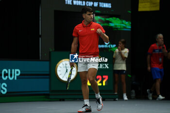 2024-09-11 - Carlos Alcaraz of Spain in action against Tomas Machac of Czech Republic during the Davis Cup 2024, Group B, tennis match played between Czech Republic and Spain at Fuente de San Luis on September 11, 2024, in Valencia, Spain. - CZECH REPUBLIC V SPAIN - DAVIS CUP 2024 GROUP B - INTERNATIONALS - TENNIS