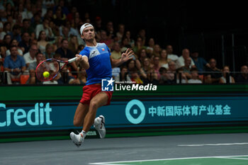 2024-09-11 - Tomas Machac of Czech Republic in action against Carlos Alcaraz of Spain during the Davis Cup 2024, Group B, tennis match played between Czech Republic and Spain at Fuente de San Luis on September 11, 2024, in Valencia, Spain. - CZECH REPUBLIC V SPAIN - DAVIS CUP 2024 GROUP B - INTERNATIONALS - TENNIS