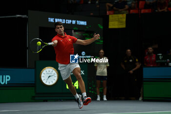 2024-09-11 - Carlos Alcaraz of Spain in action against Tomas Machac of Czech Republic during the Davis Cup 2024, Group B, tennis match played between Czech Republic and Spain at Fuente de San Luis on September 11, 2024, in Valencia, Spain. - CZECH REPUBLIC V SPAIN - DAVIS CUP 2024 GROUP B - INTERNATIONALS - TENNIS