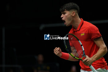 2024-09-11 - Carlos Alcaraz of Spain reacts against Tomas Machac of Czech Republic during the Davis Cup 2024, Group B, tennis match played between Czech Republic and Spain at Fuente de San Luis on September 11, 2024, in Valencia, Spain. - CZECH REPUBLIC V SPAIN - DAVIS CUP 2024 GROUP B - INTERNATIONALS - TENNIS