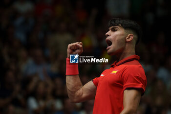 2024-09-11 - Carlos Alcaraz of Spain reacts against Tomas Machac of Czech Republic during the Davis Cup 2024, Group B, tennis match played between Czech Republic and Spain at Fuente de San Luis on September 11, 2024, in Valencia, Spain. - CZECH REPUBLIC V SPAIN - DAVIS CUP 2024 GROUP B - INTERNATIONALS - TENNIS