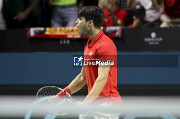 2024-11-19 - Carlos Alcaraz of Spain celebrates his victory against Tallon Griekspoor of Netherlands during the 2024 Davis Cup Finals quarter-final tennis tie between Netherlands and Spain at Palacio de Deportes Jose Maria Martin Carpena on 19 November 2024 in Malaga, Spain - TENNIS - DAVIS CUP 2024 - 1/4 - NETHERLANDS V SPAIN - INTERNATIONALS - TENNIS