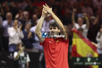 2024-11-19 - Carlos Alcaraz of Spain celebrates his victory against Tallon Griekspoor of Netherlands during the 2024 Davis Cup Finals quarter-final tennis tie between Netherlands and Spain at Palacio de Deportes Jose Maria Martin Carpena on 19 November 2024 in Malaga, Spain - TENNIS - DAVIS CUP 2024 - 1/4 - NETHERLANDS V SPAIN - INTERNATIONALS - TENNIS