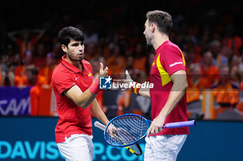 2024-11-19 - Carlos Alcaraz and Marcel Granollers of Spain play doubles during the Davis Cup 2024, quarter-final tennis event between Netherlands and Spain on 19 November 2024 in Malaga, Spain - TENNIS - DAVIS CUP 2024 - 1/4 - NETHERLANDS V SPAIN - INTERNATIONALS - TENNIS