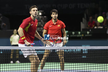 2024-11-20 - Marcel Granollers and Carlos Alcaraz of Spain during the 2024 Davis Cup Finals quarter-final tennis tie between Netherlands and Spain at Palacio de Deportes Jose Maria Martin Carpena on 19 November 2024 in Malaga, Spain - TENNIS - DAVIS CUP 2024 - 1/4 - NETHERLANDS V SPAIN - INTERNATIONALS - TENNIS