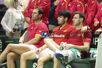 2024-11-20 - Rafael Nadal, Carlos Alcaraz, Marcel Granollers after losing the 2024 Davis Cup Finals quarter-final tennis tie between Netherlands and Spain at Palacio de Deportes Jose Maria Martin Carpena on 19 November 2024 in Malaga, Spain - TENNIS - DAVIS CUP 2024 - 1/4 - NETHERLANDS V SPAIN - INTERNATIONALS - TENNIS