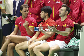 2024-11-20 - Rafael Nadal, Carlos Alcaraz, Marcel Granollers after losing the 2024 Davis Cup Finals quarter-final tennis tie between Netherlands and Spain at Palacio de Deportes Jose Maria Martin Carpena on 19 November 2024 in Malaga, Spain - TENNIS - DAVIS CUP 2024 - 1/4 - NETHERLANDS V SPAIN - INTERNATIONALS - TENNIS