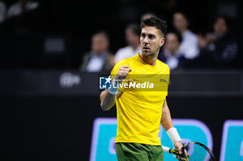 2024-11-21 - Thanasi Kokkinakis of Australia in action against Ben Shelton of USA during the Davis Cup 2024, quarter-final tennis event between United States and Australia on 21 November 2024 in Malaga, Spain - TENNIS - DAVIS CUP 2024 - 1/4 - USA V AUSTRALIA - INTERNATIONALS - TENNIS