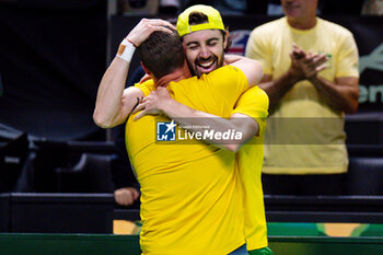 2024-11-21 - Lleyton Hewitt, Capitain of Team Australia celebrates with Jordan Thompson after winning against Ben Shelton and Tommy Paul of USA during the Davis Cup 2024, quarter-final tennis event between United States and Australia on 21 November 2024 in Malaga, Spain - TENNIS - DAVIS CUP 2024 - 1/4 - USA V AUSTRALIA - INTERNATIONALS - TENNIS