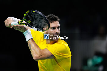 2024-11-21 - Thanasi Kokkinakis of Australia in action against Ben Shelton of USA during the Davis Cup 2024, quarter-final tennis event between United States and Australia on 21 November 2024 in Malaga, Spain - TENNIS - DAVIS CUP 2024 - 1/4 - USA V AUSTRALIA - INTERNATIONALS - TENNIS