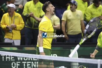 2024-11-21 - Thanasi Kokkinakis of Australia celebrates his victory against Ben Shelton of USA during the 2024 Davis Cup Finals quarter-final tennis tie between United States (USA) and Australia at Palacio de Deportes Jose Maria Martin Carpena on November 21, 2024 in Malaga, Spain - TENNIS - DAVIS CUP 2024 - 1/4 - USA V AUSTRALIA - INTERNATIONALS - TENNIS