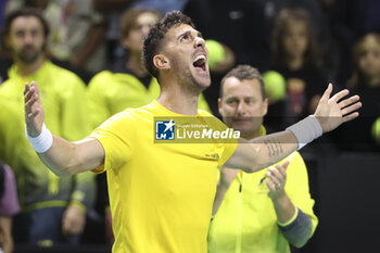 2024-11-21 - Thanasi Kokkinakis of Australia celebrates his victory against Ben Shelton of USA during the 2024 Davis Cup Finals quarter-final tennis tie between United States (USA) and Australia at Palacio de Deportes Jose Maria Martin Carpena on November 21, 2024 in Malaga, Spain - TENNIS - DAVIS CUP 2024 - 1/4 - USA V AUSTRALIA - INTERNATIONALS - TENNIS