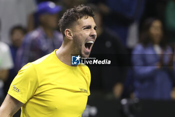 2024-11-21 - Thanasi Kokkinakis of Australia celebrates his victory against Ben Shelton of USA during the 2024 Davis Cup Finals quarter-final tennis tie between United States (USA) and Australia at Palacio de Deportes Jose Maria Martin Carpena on November 21, 2024 in Malaga, Spain - TENNIS - DAVIS CUP 2024 - 1/4 - USA V AUSTRALIA - INTERNATIONALS - TENNIS