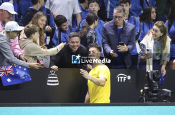 2024-11-21 - Thanasi Kokkinakis of Australia poses for fans after his victory against Ben Shelton of USA during the 2024 Davis Cup Finals quarter-final tennis tie between United States (USA) and Australia at Palacio de Deportes Jose Maria Martin Carpena on November 21, 2024 in Malaga, Spain - TENNIS - DAVIS CUP 2024 - 1/4 - USA V AUSTRALIA - INTERNATIONALS - TENNIS