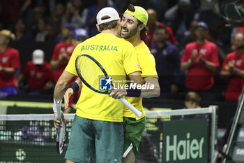 2024-11-21 - Matthew Ebden and Jordan Thompson of Australia celebrate their victory against Tommy Paul and Ben Shelton of USA during the 2024 Davis Cup Finals quarter-final tennis tie between United States (USA) and Australia at Palacio de Deportes Jose Maria Martin Carpena on November 21, 2024 in Malaga, Spain - TENNIS - DAVIS CUP 2024 - 1/4 - USA V AUSTRALIA - INTERNATIONALS - TENNIS