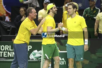 2024-11-21 - Captain Lleyton Hewitt, Matthew Ebden and Jordan Thompson of Australia celebrate their doubles victory against Tommy Paul and Ben Shelton of USA during the 2024 Davis Cup Finals quarter-final tennis tie between United States (USA) and Australia at Palacio de Deportes Jose Maria Martin Carpena on November 21, 2024 in Malaga, Spain - TENNIS - DAVIS CUP 2024 - 1/4 - USA V AUSTRALIA - INTERNATIONALS - TENNIS