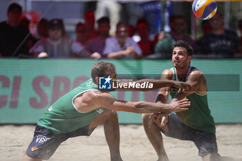 2024-06-23 - Carlo Bonifazi (ITA) and Davide Benzi (ITA) with a forearm pass - WORLD BEACH PRO TOUR - BEACH VOLLEY - VOLLEYBALL