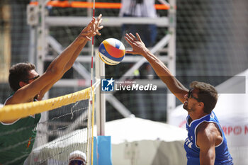 2024-06-23 - Carlo Bonifazi (ITA) with a spike on Gianluca Dal Corso (ITA) - WORLD BEACH PRO TOUR - BEACH VOLLEY - VOLLEYBALL