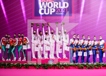2021-05-29 - Award ceremony group with Russian group team, Bulgaria group team and Belarus group team during the Rhythmic Gymnastics FIG World Cup 2021 Pesaro at Vitrifrigo Arena, Pesaro, Italy on May 29, 2021 - Photo FCI / Fabrizio Carabelli - RHYTHMIC GYMNASTICS WORLD CUP 2021 - GYMNASTICS - OTHER SPORTS