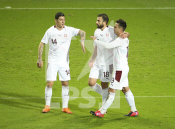 2020-11-11 - Admir Mehmedi of Switzerland (#18) celebrates his goal with Steven Zuber and Mario Gavranovic during the international friendly football match between Belgium and Switzerland on November 11, 2020 at King Power at Den Dreef Stadion in Leuven, Louvain, Belgium - Photo Jean Catuffe / DPPI - FRIENDLY FOOTBALL MATCH BETWEEN BELGIUM AND SWITZERLAND - FRIENDLY MATCH - SOCCER