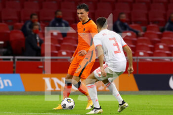 2020-11-11 - Steven Berghuis of The Netherlands, Sergio Reguilon of Spain during the International Friendly football match between Netherlands and Spain on november 11, 2020 at Johan Cruijff Arena in Amsterdam, Netherlands - Photo Marcel ter Bals / Orange Pictures / DPPI - FRIENDLY FOOTBALL MATCH BETWEEN NETHERLANDS AND SPAIN - FRIENDLY MATCH - SOCCER