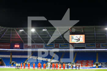 2021-03-27 - Players observe a minute's silence in memory of Dai Davies before the international friendly football match between Wales and Mexico on March 27, 2021 at the Cardiff City Stadium in Cardiff, Wales - Photo Gruffydd Thomas / ProSportsImages / DPPI - WALES AND MEXICO - FRIENDLY MATCH - SOCCER