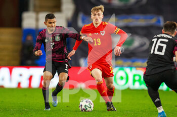 2021-03-27 - Mexico midfielder Orbelín Pineda (7) and Wales midfielder Matthew Smith (19) during the international friendly football match between Wales and Mexico on March 27, 2021 at the Cardiff City Stadium in Cardiff, Wales - Photo Gruffydd Thomas / ProSportsImages / DPPI - WALES AND MEXICO - FRIENDLY MATCH - SOCCER
