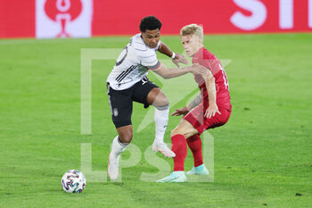 2021-06-02 - Serge Gnabry of Germany and Daniel Wass of Denmark during the Friendly Football match between Germany and Denmark on June 2, 2021 at Tivoli Stadion in Innsbruck, Austria - Photo Ralf Ibing / firo Sportphoto / DPPI - FRIENDLY MATCH 2021 - GERMANY VS DENMARK - FRIENDLY MATCH - SOCCER