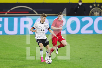 2021-06-02 - Thomas Mueller of Germany and Pierre-Emile Hojbjerg of Denmark during the Friendly Football match between Germany and Denmark on June 2, 2021 at Tivoli Stadion in Innsbruck, Austria - Photo Ralf Ibing / firo Sportphoto / DPPI - FRIENDLY MATCH 2021 - GERMANY VS DENMARK - FRIENDLY MATCH - SOCCER