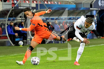 2021-03-27 - Justin Kluivert of The Netherlands U21, Ismail Jacobs of Germany U21 during the 2021 UEFA Under 21 Euro Championship, Group A football match between Germany U21 and Netherlands U21 on March 27, 2021 at Mol Arena Sosto in Szekesfehervar, Hungary - Photo Gerrit van Keulen / Orange Pictures / DPPI - 2021 UEFA UNDER 21 EURO CHAMPIONSHIP, GROUP A - GERMANY U21 VS NETHERLANDS U21 - UEFA EUROPEAN - SOCCER