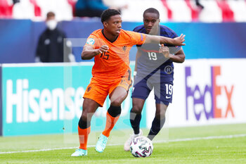 2021-05-31 - Tyrell Malacia of Netherlands U21 battles for possession with Moussa Diaby of France U21 during the 2021 UEFA European Under-21 Championship, Quarter-Finals football match between Netherlands U21 and France U21 on May 31, 2021 at Boszik Arena in Budapest, Hungary - Photo Istvan Derencsenyi / Orange Pictures / DPPI - 2021 UEFA EUROPEAN UNDER-21 CHAMPIONSHIP, QUARTER-FINALS - NETHERLANDS U21 VS FRANCE U21 - UEFA EUROPEAN - SOCCER