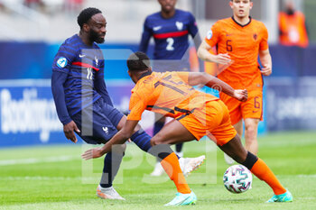 2021-05-31 - Jonathan Ikone of France U21 battles for possession with Tyrell Malcia of Netherlands U21 during the 2021 UEFA European Under-21 Championship, Quarter-Finals football match between Netherlands U21 and France U21 on May 31, 2021 at Boszik Arena in Budapest, Hungary - Photo Istvan Derencsenyi / Orange Pictures / DPPI - 2021 UEFA EUROPEAN UNDER-21 CHAMPIONSHIP, QUARTER-FINALS - NETHERLANDS U21 VS FRANCE U21 - UEFA EUROPEAN - SOCCER