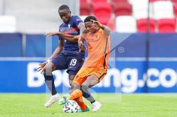 2021-05-31 - Moussa Diaby of France U21 battles for possession with Tyrell Malcia of Netherlands U21 during the 2021 UEFA European Under-21 Championship, Quarter-Finals football match between Netherlands U21 and France U21 on May 31, 2021 at Boszik Arena in Budapest, Hungary - Photo Istvan Derencsenyi / Orange Pictures / DPPI - 2021 UEFA EUROPEAN UNDER-21 CHAMPIONSHIP, QUARTER-FINALS - NETHERLANDS U21 VS FRANCE U21 - UEFA EUROPEAN - SOCCER