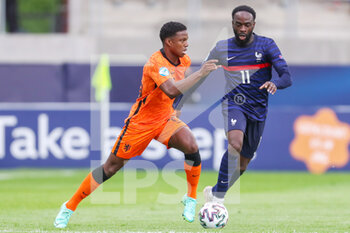2021-05-31 - Tyrell Malcia of Netherlands U21 battles for possession with Jonathan Ikone of France U21 during the 2021 UEFA European Under-21 Championship, Quarter-Finals football match between Netherlands U21 and France U21 on May 31, 2021 at Boszik Arena in Budapest, Hungary - Photo Istvan Derencsenyi / Orange Pictures / DPPI - 2021 UEFA EUROPEAN UNDER-21 CHAMPIONSHIP, QUARTER-FINALS - NETHERLANDS U21 VS FRANCE U21 - UEFA EUROPEAN - SOCCER