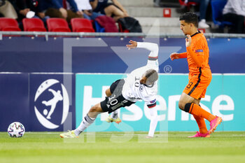 2021-06-03 - Lukas Nmecha of Germany U21 is fouled by Abderrahman Harroui of the Netherlands U21 during the 2021 UEFA European Under-21 Championship, Semi-Finals football match between Netherlands and Germany on June 3, 2021 at MOL Arena Sosto in Szekesfehervar, Hungary - Photo Istvan Derencsenyi / Orange Pictures / DPPI - 2021 UEFA EUROPEAN UNDER-21 CHAMPIONSHIP, SEMI-FINALS FOOTBALL MATCH BETWEEN NETHERLANDS AND GERMANY - UEFA EUROPEAN - SOCCER