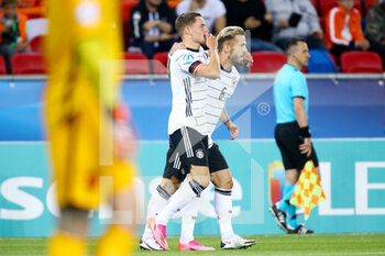 2021-06-03 - Florian Wirtz of Germany U21 celebrates after scoring his sides second goal with Niklas Dorsch during the 2021 UEFA European Under-21 Championship, Semi-Finals football match between Netherlands and Germany on June 3, 2021 at MOL Arena Sosto in Szekesfehervar, Hungary - Photo Istvan Derencsenyi / Orange Pictures / DPPI - 2021 UEFA EUROPEAN UNDER-21 CHAMPIONSHIP, SEMI-FINALS FOOTBALL MATCH BETWEEN NETHERLANDS AND GERMANY - UEFA EUROPEAN - SOCCER