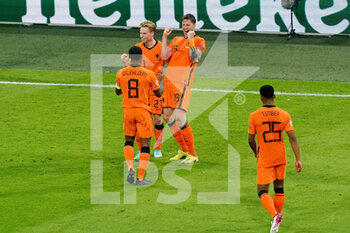 2021-06-14 - Wout Weghorst of the Netherlands celebrates with Frenkie de Jong and Georginio Wijnaldum of the Netherlands after scoring his sides second goal during the UEFA Euro 2020, Group C football match between Netherlands and Ukraine on June 13, 2021 at the Johan Cruijff ArenA in Amsterdam, Netherlands - Photo Andre Weening / Orange Pictures / DPPI - UEFA EURO 2020, GROUP C FOOTBALL - NETHERLANDS VS UKRAINE - UEFA EUROPEAN - SOCCER