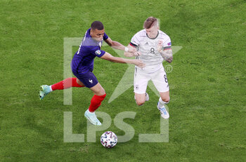 2021-06-15 - Kylian Mbappe of France, Toni Kroos of Germany during the UEFA Euro 2020, Group F football match between France and Germany on June 15, 2021 at Allianz Arena in Munich, Germany - Photo Jurgen Fromme / firo sportphoto / DPPI - UEFA EURO 2020, GROUP F - FRANCE VS GERMANY - UEFA EUROPEAN - SOCCER