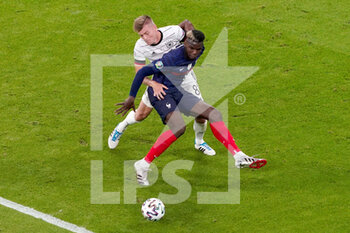 2021-06-15 - Paul Pogba of France, Toni Kroos of Germany during the UEFA Euro 2020, Group F football match between France and Germany on June 15, 2021 at Allianz Arena in Munich, Germany - Photo Andre Weening / Orange Pictures / DPPI - UEFA EURO 2020, GROUP F - FRANCE VS GERMANY - UEFA EUROPEAN - SOCCER