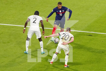 2021-06-15 - Kylian Mbappe of France and Antonio Rudiger, Robin Gosens of Germany during the UEFA Euro 2020, Group F football match between France and Germany on June 15, 2021 at Allianz Arena in Munich, Germany - Photo Andre Weening / Orange Pictures / DPPI - UEFA EURO 2020, GROUP F - FRANCE VS GERMANY - UEFA EUROPEAN - SOCCER