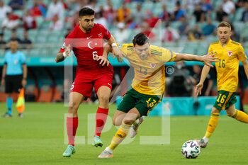 2021-06-16 - Ozan Tufan of Turkey and Kieffer Moore of Wales during the UEFA Euro 2020, Group A football match between Turkey and Wales on June 16, 2021 at Baku Olympic Stadium in Baku, Azerbaijan - Photo Orange Pictures / DPPI - UEFA EURO 2020, GROUP A - TURKEY VS WALES - UEFA EUROPEAN - SOCCER