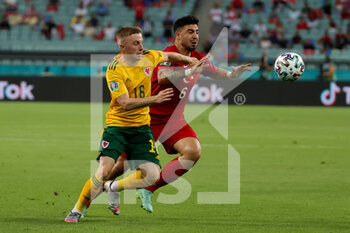 2021-06-16 - Joe Morrell of Wales and Ozan Tufan of Turkey during the UEFA Euro 2020, Group A football match between Turkey and Wales on June 16, 2021 at Baku Olympic Stadium in Baku, Azerbaijan - Photo Orange Pictures / DPPI - UEFA EURO 2020, GROUP A - TURKEY VS WALES - UEFA EUROPEAN - SOCCER
